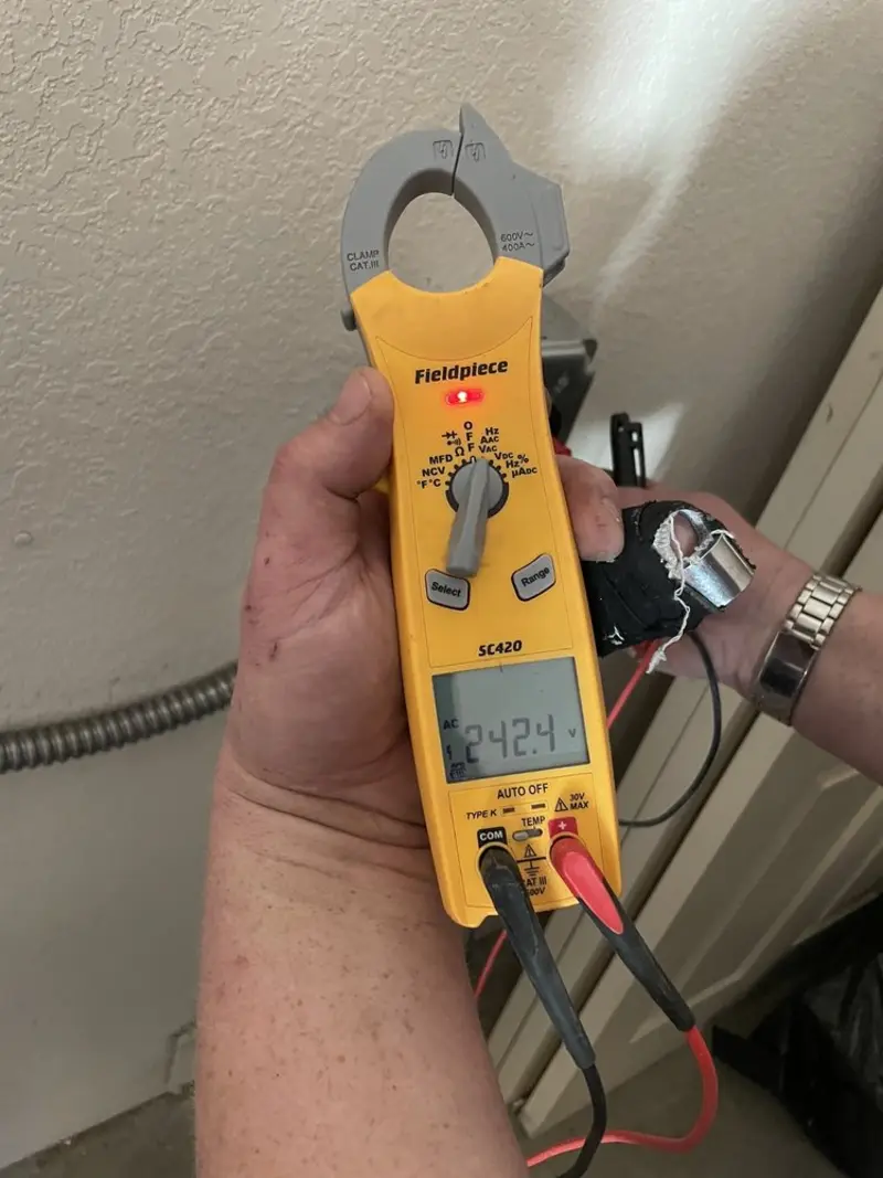 Voltage testing with clamp meter during Electrical Installation Services in South Bend